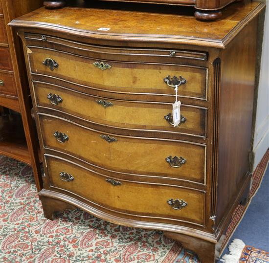 A Georgian style walnut serpentine chest W.72cm